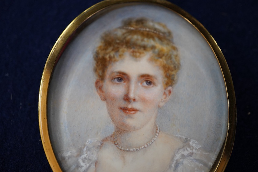 Edwardian School, Portrait miniature of a young lady wearing a beaded necklace, oval watercolour on ivory, 6 x 5cm, housed in a gilt metal pendant frame CITES Submission reference, 1RZX399Q